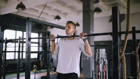 Pulls up on bar in gym Video stock 112942911