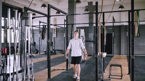 Pulls up on bar in gym Stock Footage 112948674