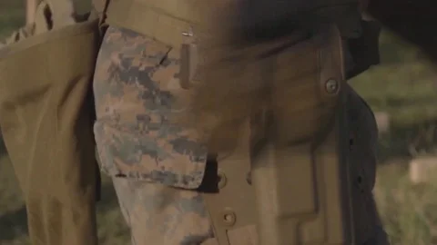 Pulls a gun out of its holster, Shoots then hides the gun in its holster Stock Footage 120732738