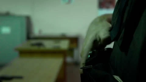 Pulls out a gun and aiming Stock Footage 113215621