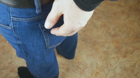 Pulls out a Trouser pocket a packet of drugs.Ziploc with medical marijuana. Stock Footage 129695805