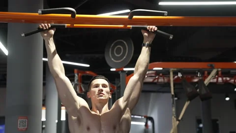 Pullup. muscular athlete practicing pullup in sport gym. athlete do pullup Stock Footage 233007846