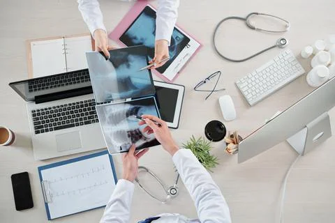 Pulmonologists comparing x-rays Stock Photos