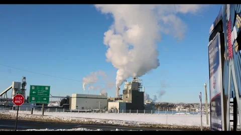 Pulp and Paper Mill Emitting Smoke in Winter Landscape Stock Footage 330196845