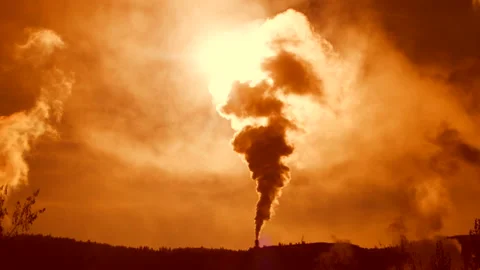 Pulp mill exhaust rises into a setting sun, 4k Stock Footage 164612164