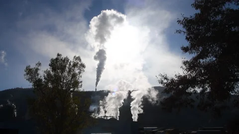 Pulp mill exhaust rises into sky and blocks sun, global warming, 4k Stock Footage 164612120