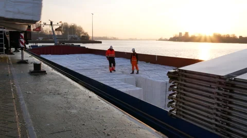 Pulp moved by crane from ship three shot sequence 29 January 2022, Amsterdam Stock Footage 293899015