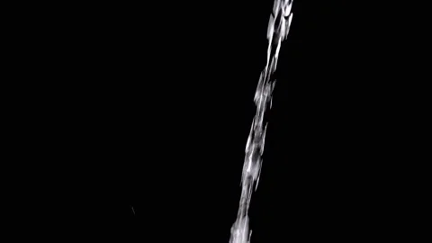 Pulsating Stream of Water, with Splashes, Pours on a Black Background Video stock 312013222