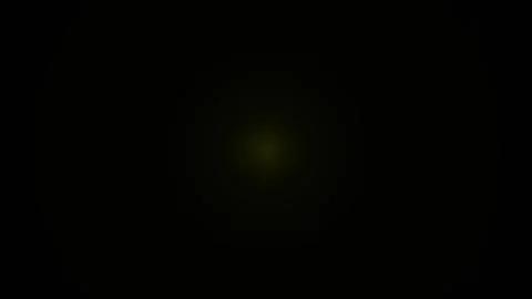 Pulsating yellow light on dark background, seamless loop, abstract motion, .. Stock Footage 336476123