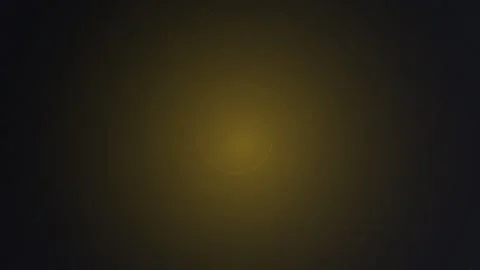 Pulsating yellow light transitions between darkness and warmth Stock Footage 326261163