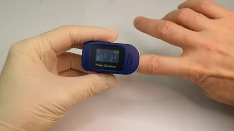 Pulse oximeter to check the pulse of the amount of oxygen in the blood. Stock-Footage 145708835