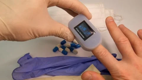 Pulse oximeter to check the pulse of the amount of oxygen in the blood. Stock-Footage 145708854