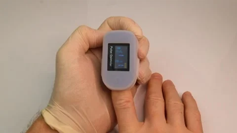 Pulse oximeter to check the pulse of the amount of oxygen in the blood. Stock-Footage 145708913