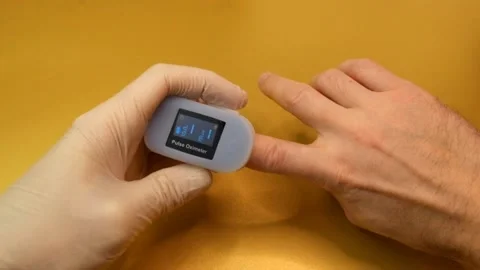 Pulse oximeter to check the pulse of the amount of oxygen in the blood. Stock-Footage 145708928