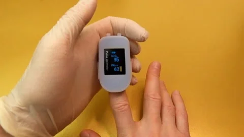 Pulse oximeter to check the pulse of the amount of oxygen in the blood. Stock-Footage 145708943