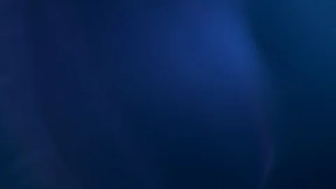 Pulsing cold light changes in intensity over a black background Stock Footage 106349499