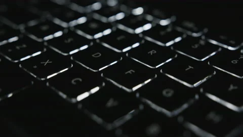Pulsing lights on diagonal movement across laptop keyboard keys Stock Footage 146992280
