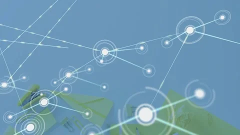 Pulsing node sending line, network expanding across desk, overlay settling atop Stock Footage 331026777