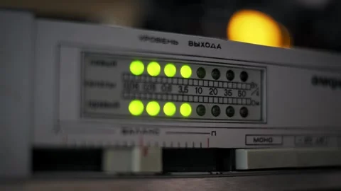 Pulsing Stereo Level Meter with Warm Bokeh Stock Footage 319068368