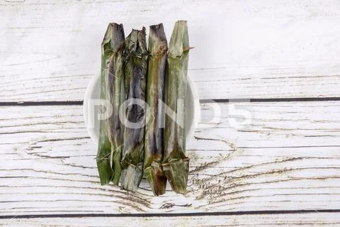 Pulut panggang or grilled glutinous rice package, Malay or Nonya cuisine most Stock Photos
