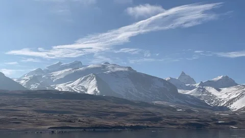 Puma Yumco Snow Mountain Range and Linear Clouds Timelapse Stock Footage 333486930