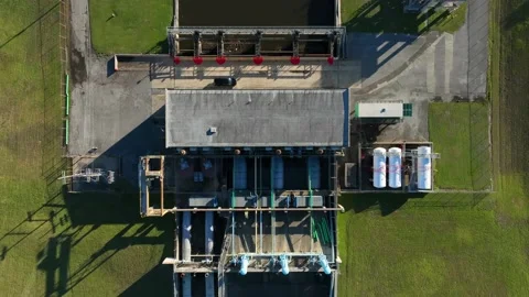 Pump and levee system to protect city from flooding. Aerial view at Lake Stock Footage 225653181