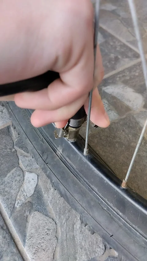 Pump up bicycle wheel close up Stock Footage 338395942