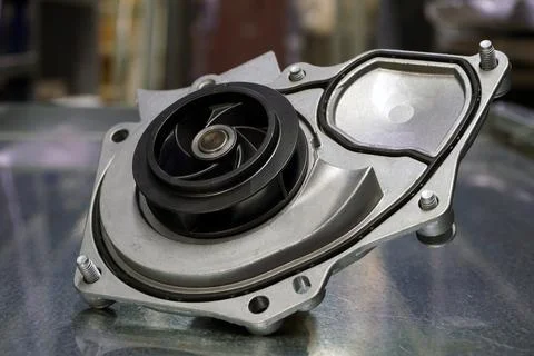 The pump of the engine cooling system of a modern car. Stock Photos