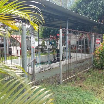 Pump engine at refueling station Stock Photos