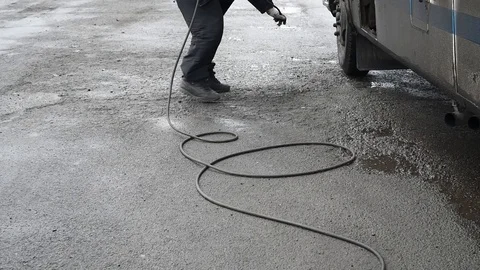 The pump inflates the dirty wheel in the rain in natural light Stock Footage 107089264