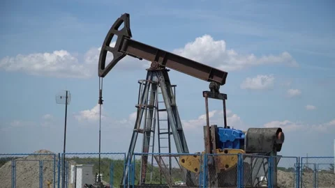 Pump Jack Extracting Crude Oil from a Oil Well. Stock Footage 278807785