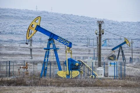 Pump Jack. Oilfield derrick. Stock Photos