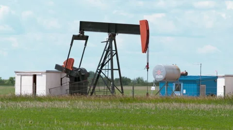 Pump jack in the prairies Stock Footage 67613377