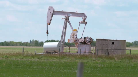 Pump jack in the prairies Stock Footage 67613590