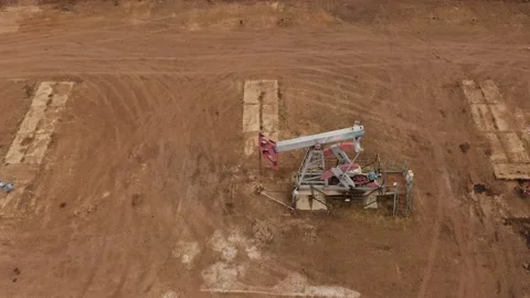 Pump jack in vast oil fields in Russia. Pipelines transporting oil from oil Stock Footage 170508554