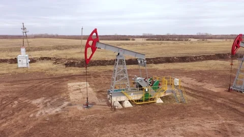 Pump jack in vast oil fields in Russia. Pipelines transporting oil from oil Video stock 170508625