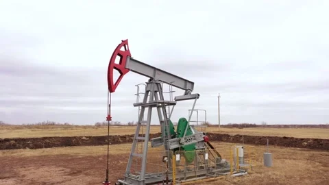 Pump jack in vast oil fields in Russia. Pipelines transporting oil from oil Stock-Footage 170669309