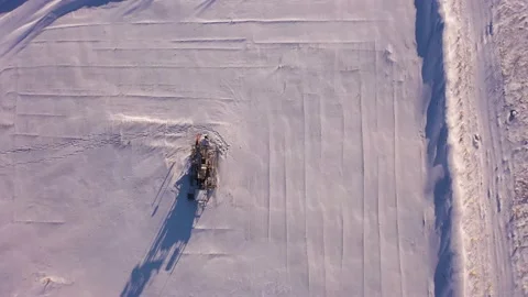 Pump jack in vast oil fields in winter. Pipelines transporting oil from oil Stock Footage 171918737