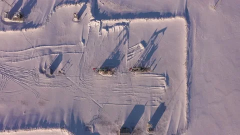 Pump jack in vast oil fields in winter. Pipelines transporting oil from oil Stock Footage 172204584
