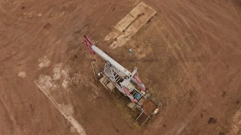 Pump jack in vast oil fields in Russia. Pipelines transporting oil from oil Stock Footage 172538203