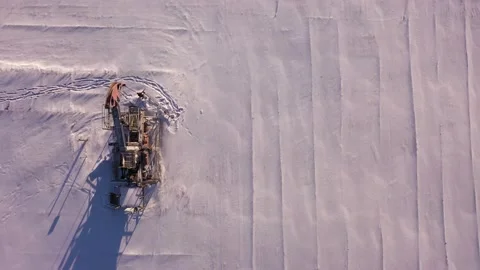 Pump jack in vast oil fields in winter. Pipelines transporting oil from oil Stock Footage 174871690