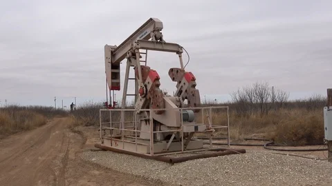 Pump jack working In the oil field. Stock Footage 85711537