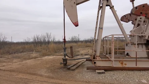 Pump jack working In the oil field. Stock Footage 85711544
