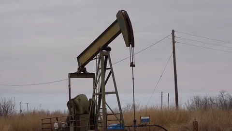 Pump jack working In the oil field. Stock Footage 85711564