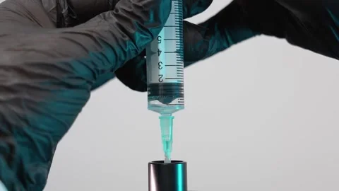 Pump out the perfume with a syringe Stock Footage 158463440
