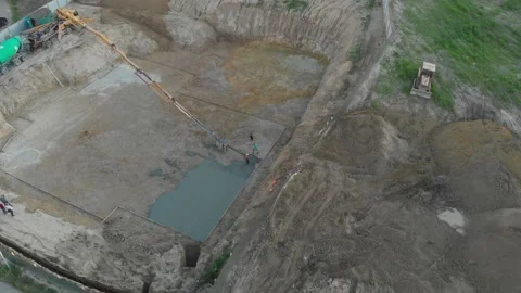 A pump pouring concrete at the construction site Stock Footage 145754149