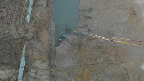 A pump pouring concrete at the construction site Stock Footage 145754402