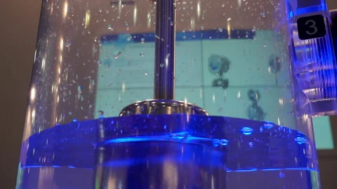 Pump for pumping water inside a transparent flask Stock Footage 139141484