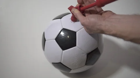 Pump up a soccer ball 2 Stock Footage 125117325