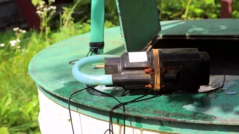 Pump for water to the well Stock Footage 80905663